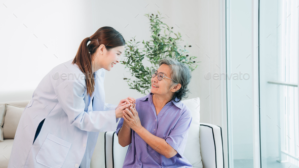 Medical staff taking and caregiver senior woman in Home. Healthcare and Home Care Concept.