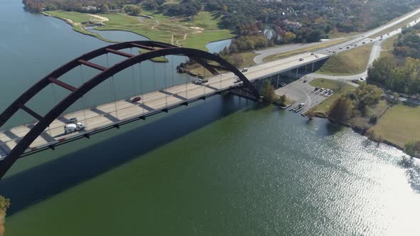 This video is about an aerial of the Pennybacker Bridge in Austin, Texas. The bridge passes over Lak alt