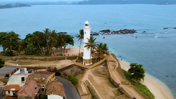 Aerial drone of Galle fort Lighthouse at sunset golden hour. Galle Dutch Fort, Sri lanka alt