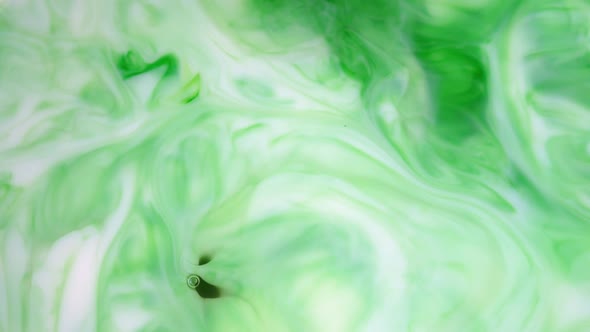  Footage. Ink in Water. Green Ink Reacting in Water Creating Abstract Background