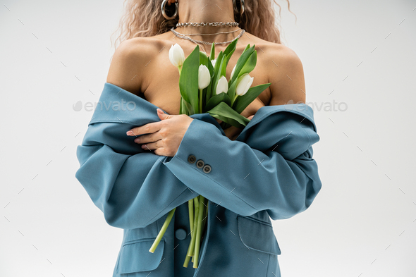 partial view of sensual woman with wavy ash blonde hair posing in