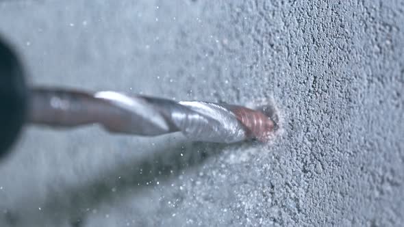 Super Slow Motion Detail Shot of Drilling Concrete at 1000 Fps alt