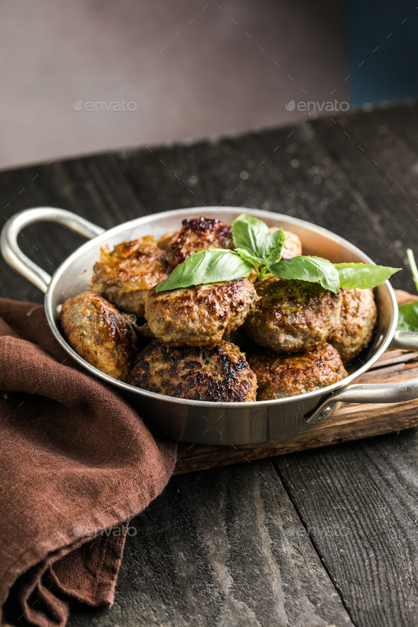 Homemade croquettes or patties. Fritters from minced pork. Delicious and nutritious lunch or