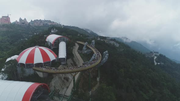 Aerial view of Golden bridge in Ba Na Hills, Da Nang. Cable car alt