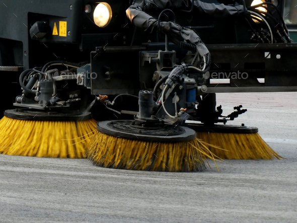 Closeup shot of a sweeping machine cleaning the floor