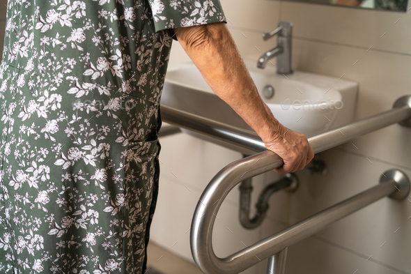 Asian elderly woman patient use toilet bathroom handle security