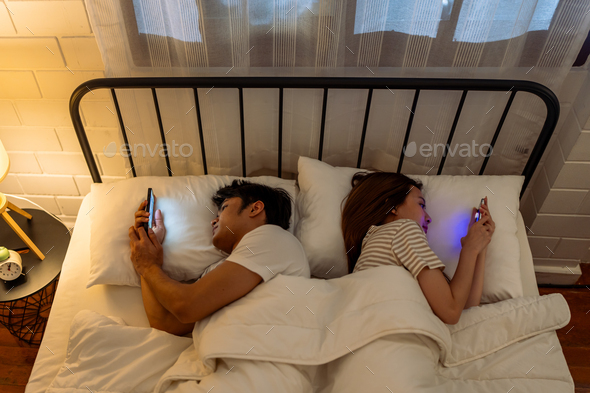 Asian young phone addict couple don\'t pay attention with each other.