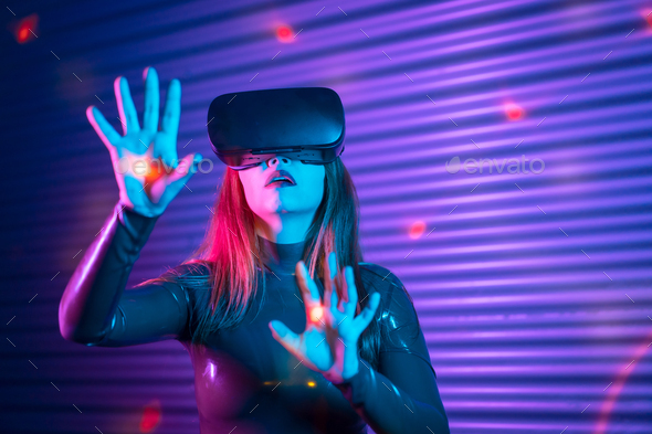 Woman during an interactive game with VR goggles