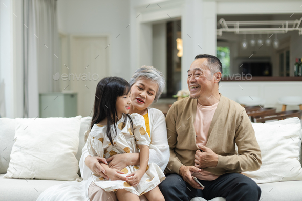 Happy Family Grandfather Grandmother and Granddaughter having fun ...