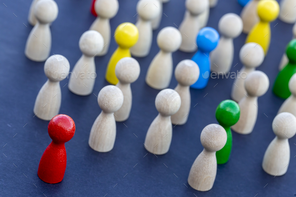 To be different, to be a leader, to lead. icon expression with colorful wooden figures.