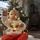 Toddler sitting on floor and playing with Christmas lights - PhotoDune Item for Sale