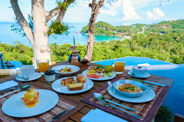 Luxury breakfast with a view at the pool and ocean in Thailand