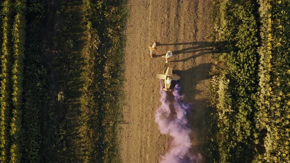 Aerial Top View  Parents Play an Aviator with Their Child