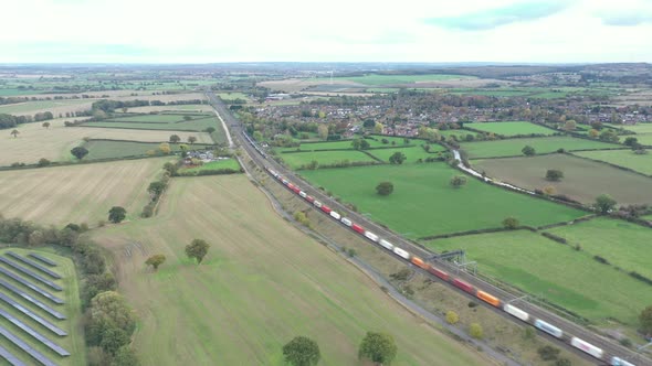 Aerial view of railway in the countryside and trains passing