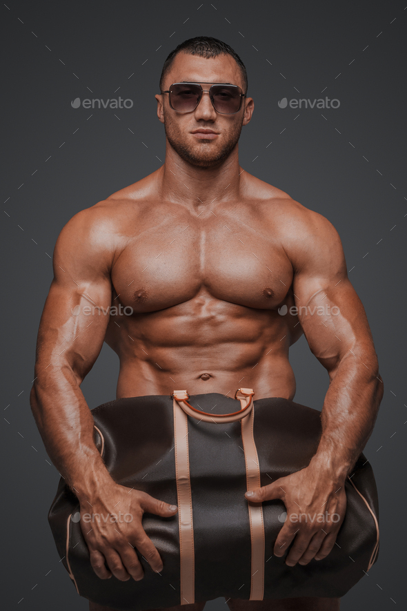 Rugged Portrait with Luxury Bag and Gray Background