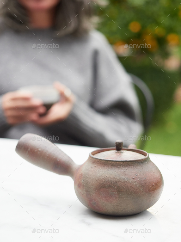 traditional sidehandle Japanese clay teapot called "kyusu". Stock