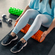 Sport woman using foam roller for muscle and fascia stretching foot. Stock  Photo by puhimec