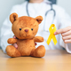 International Childhood Cancer Awareness month, Doctor with Children toy  - PhotoDune Item for Sale