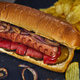 Hot dog -Hot sausage nested in a bun with cucumbers, red pepper and onions.  - PhotoDune Item for Sale