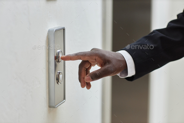 Businessman Finger Pressing Lift Button
