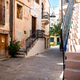 Chania Old Town, Crete island Greece. Traditional weathered building with stair, plant, paved alley. - PhotoDune Item for Sale