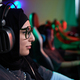 Muslim Woman Playing Video Games in Cybersports Club - PhotoDune Item for Sale