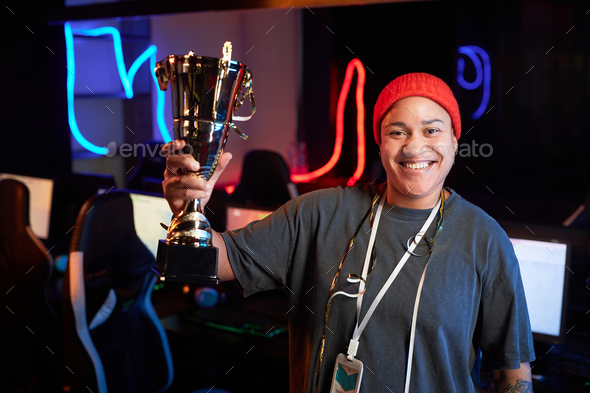 Smiling Black Woman Celebrating Victory in eSports Tournament