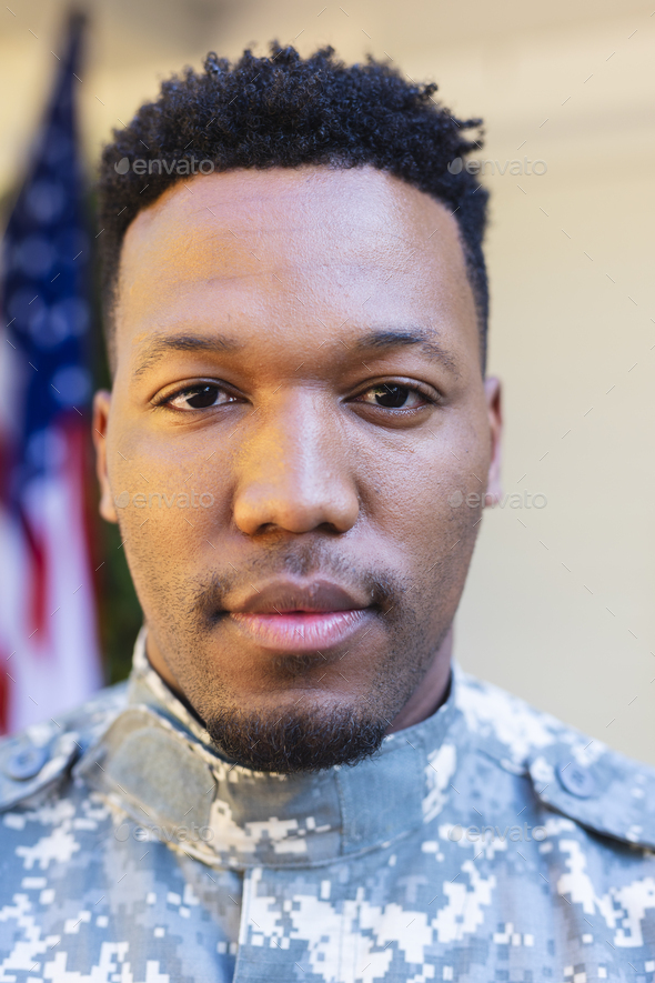 Focused african american male soldier face close up outside home with ...