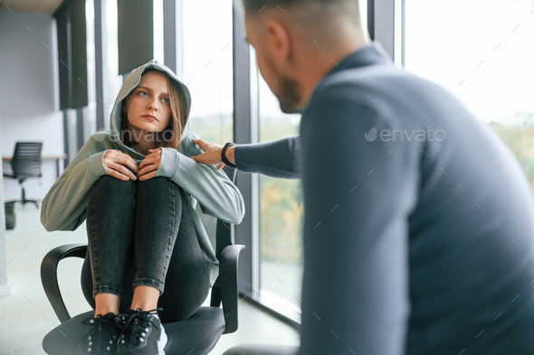 Depressed woman is at an appointment with a psychologist