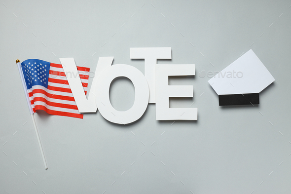 Word Vote, America flag and voting form on gray background, top view