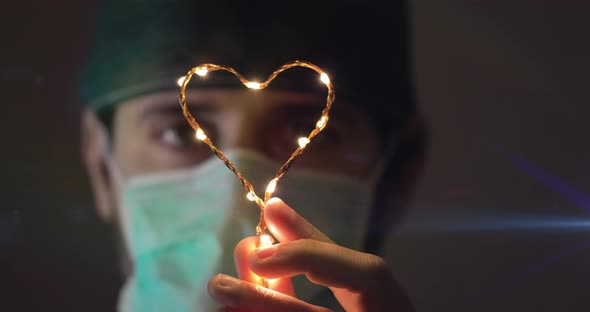 Doctor is Holding an Heart alt