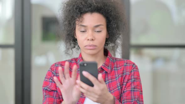African Woman Using Smartphone Browsing Internet alt
