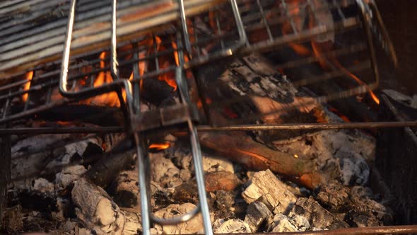 Delicious White Mackerel Fish is Roasted and Flipped on the Barbeque Grill alt