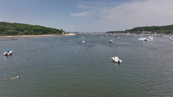 An aerial view of the Northport Marina on Long island, NY with many anchored boats. It is a sunny da alt