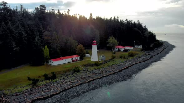 Vancouver Island Canada Quadra Island Old Historical Lighthouse at Cape Mudge Couple in Yellow Rain alt