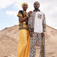 African American Couple in Traditional Clothing in Desert Stock