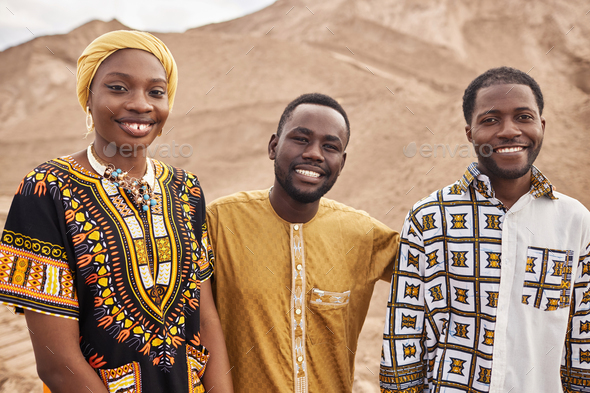 Group of African American People in Traditional Clothing in Desert
