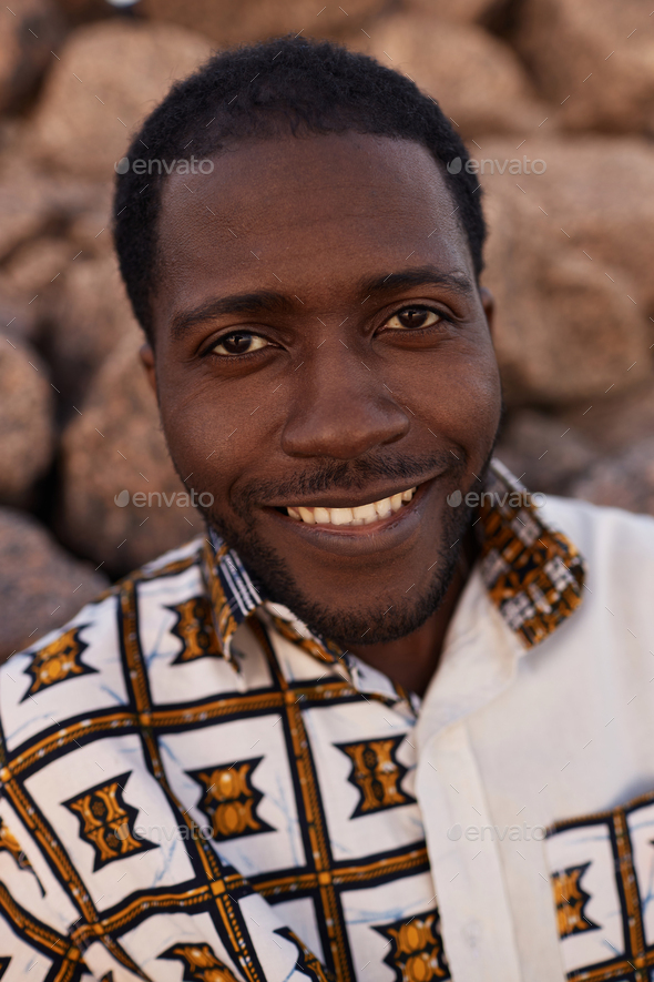 Smiling African American man wearing traditional print Stock Photo