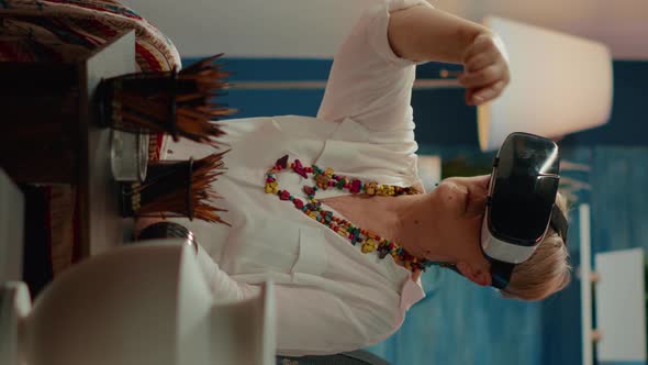 Vertical Video Senior Woman Using Vr Glasses with Augmented Reality to Create Drawing alt