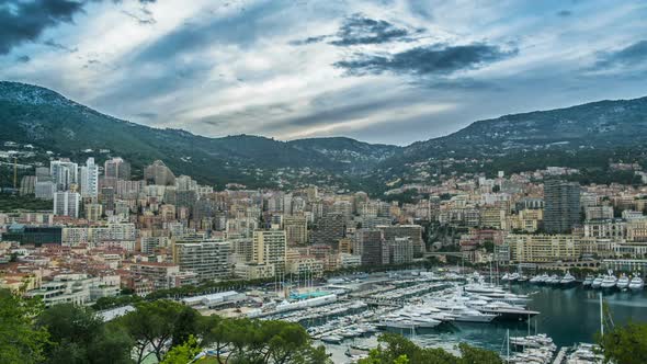 Seaside Built-Up Town in Harbor With Moored Sail Boats, Day-To-Night Time Lapse alt