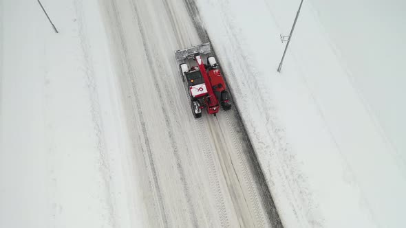 Snow clearing. Tractor clears the way after heavy snowfall.