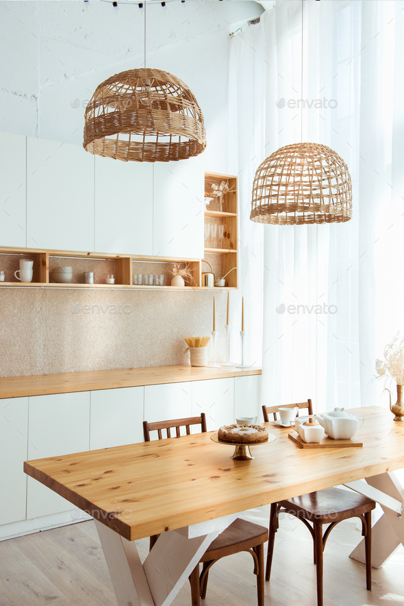 Kitchen interior in eco style and furniture made of natural wood. Open storage on shelves.