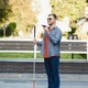 young blind man with white cane walking across the street in city Stock  Photo by sedrik2007