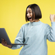 Happy attractive young Asian woman using laptop, wearing stylish sweater, gesturing, good news - PhotoDune Item for Sale