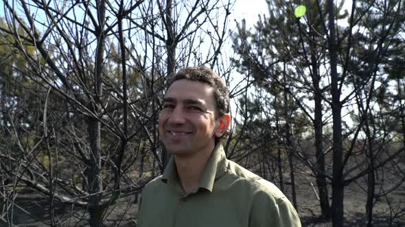Man in Forest Smiling Optimist