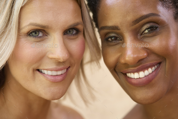 Close Up Beauty Portrait Showing Faces Of Two Smiling Mature Women