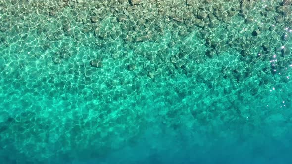 Waves and azure water as a background. View from drone at the ocean surface. alt