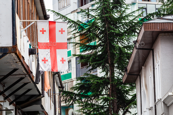 Georgian flag on balcony of residential building
