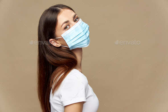 woman stylish clothes in a face mask health prevention