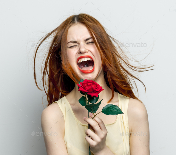 emotional woman with rose flower displeasure cry isolated background ...